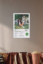RCA Crtl Album Wall Art Poster in a cozy movie room above a brown sofa with popcorn.