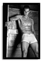 Rafael Nadal framed wall art print with a black border, portraying him shirtless in white briefs against metal panels.