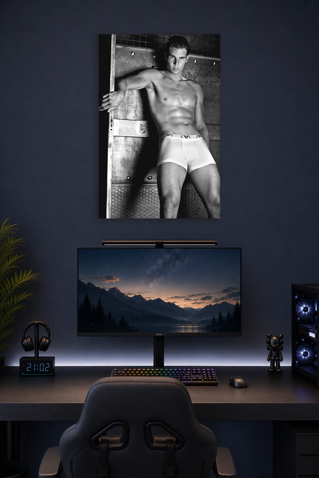 Rafael Nadal in a gaming desk setup above a monitor.