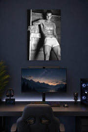 Rafael Nadal in a gaming desk setup above a monitor.