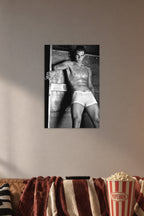 Rafael Nadal in a cozy movie room above a brown sofa with popcorn.