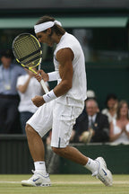 Rafael Nadal tennis wall art print captures him leaping on a grass court, gripping a yellow racket in white kit.