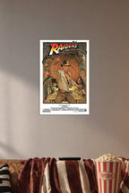 Raiders of the Lost Ark 1982 Movie in a cozy movie room above a brown sofa with popcorn.