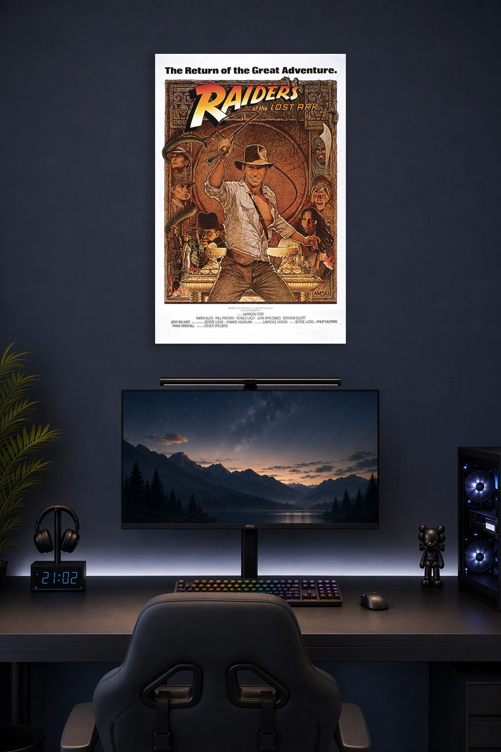 Raiders of the Lost Ark Indiana Jones in a gaming desk setup above a monitor.