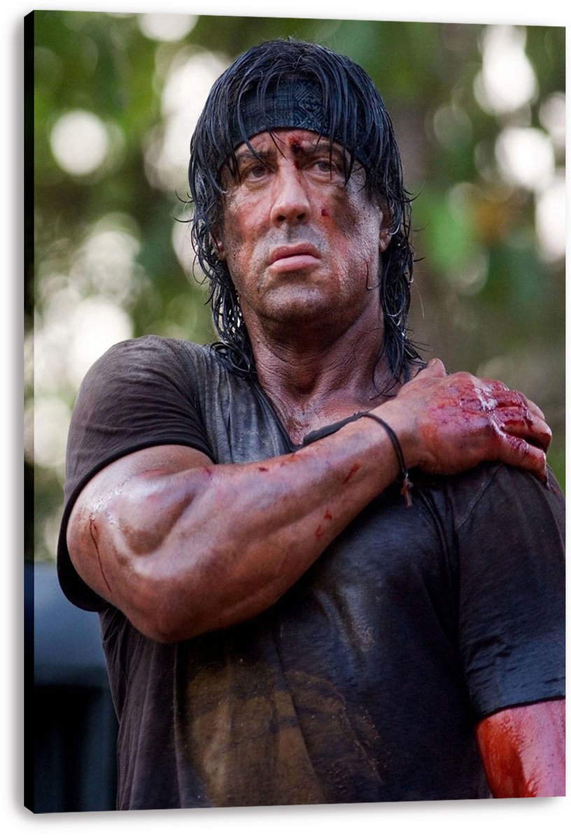Rambo canvas wall art print featuring Sylvester Stallone bruised and bloodied in a dark shirt, displayed with visible wrapped edges.