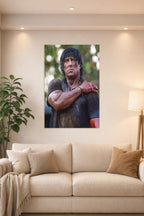 Rambo Sylvester Stallone in a bright living room above a beige sofa.
