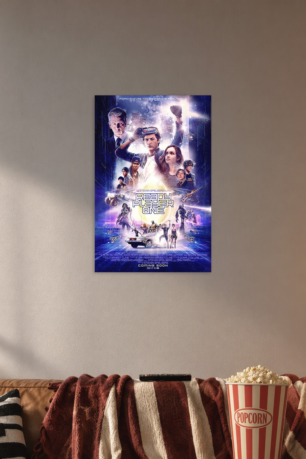 Ready Player One Movie Poster in a cozy movie room above a brown sofa with popcorn.