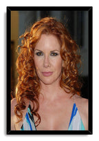 Redhead celebrity framed wall art print with a black border, copper curly hair, brown eyes, and blue patterned dress.