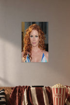 Redhead Celebrity in a cozy movie room above a brown sofa with popcorn.