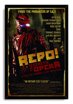 Repo! The Genetic Opera framed wall art print with a black border, red masked figure, blue goggles, and distressed yellow title lettering.