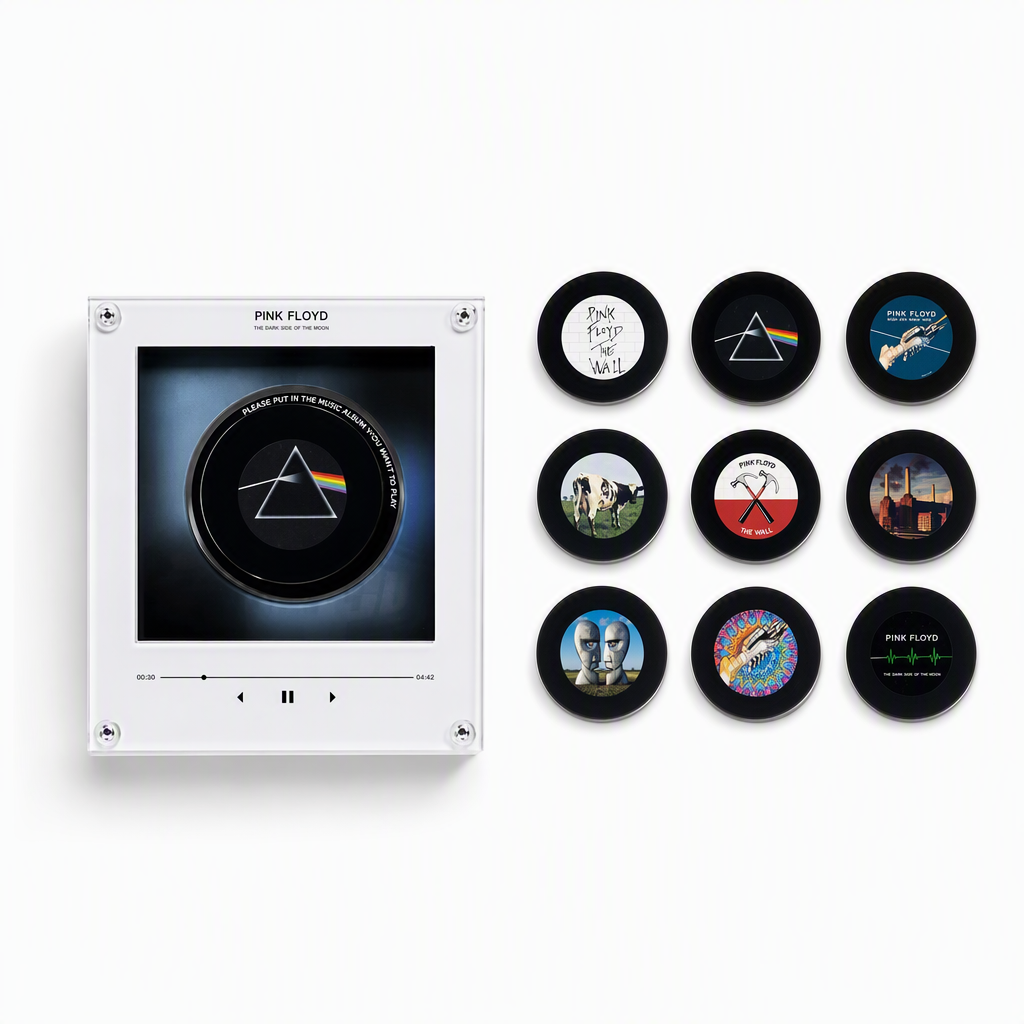 Retro mini vinyl record music player with Pink Floyd prism artwork and nine black discs featuring varied album designs.