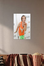 Richard Simmons in a cozy movie room above a brown sofa with popcorn.