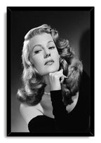 Rita Hayworth framed wall art print with a black border, depicting her classic black-and-white portrait in an off-shoulder gown.