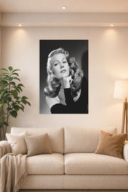 Rita Hayworth in a bright living room above a beige sofa.