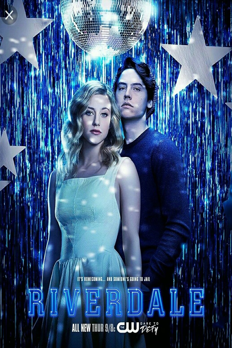 Riverdale wall art print of Betty Cooper and Jughead Jones posed against blue metallic streamers, silver stars, and a disco ball.