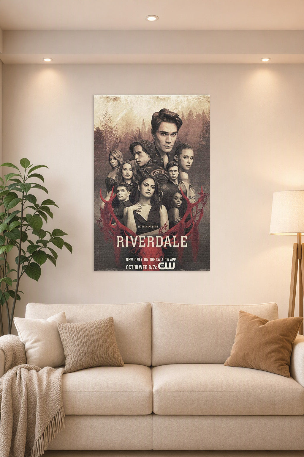 Riverdale Cast in a bright living room above a beige sofa.