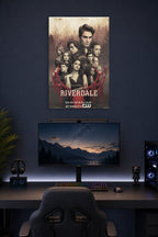Riverdale Cast in a gaming desk setup above a monitor.