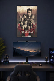 Riverdale Cast in a gaming desk setup above a monitor.