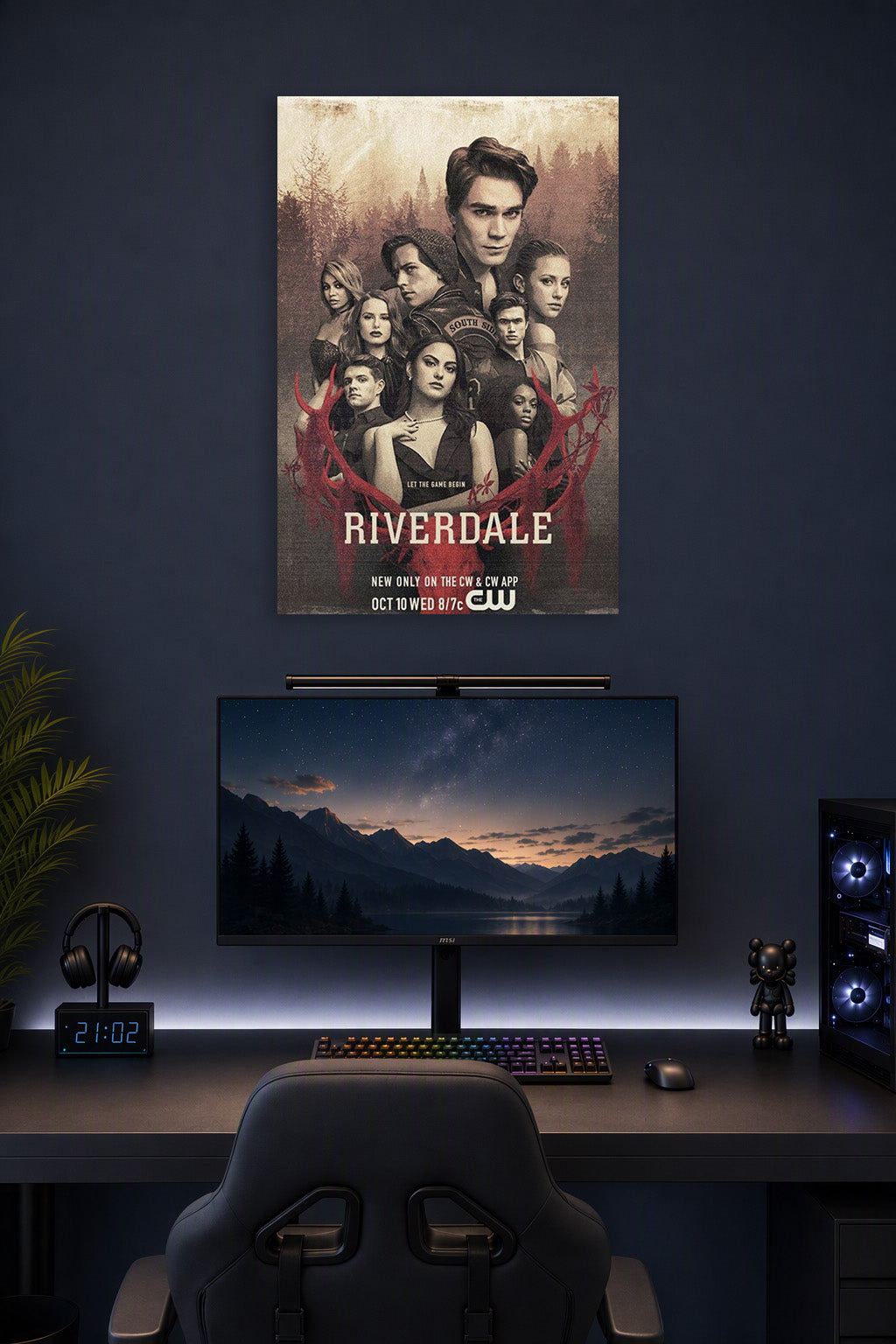 Riverdale Cast in a gaming desk setup above a monitor.
