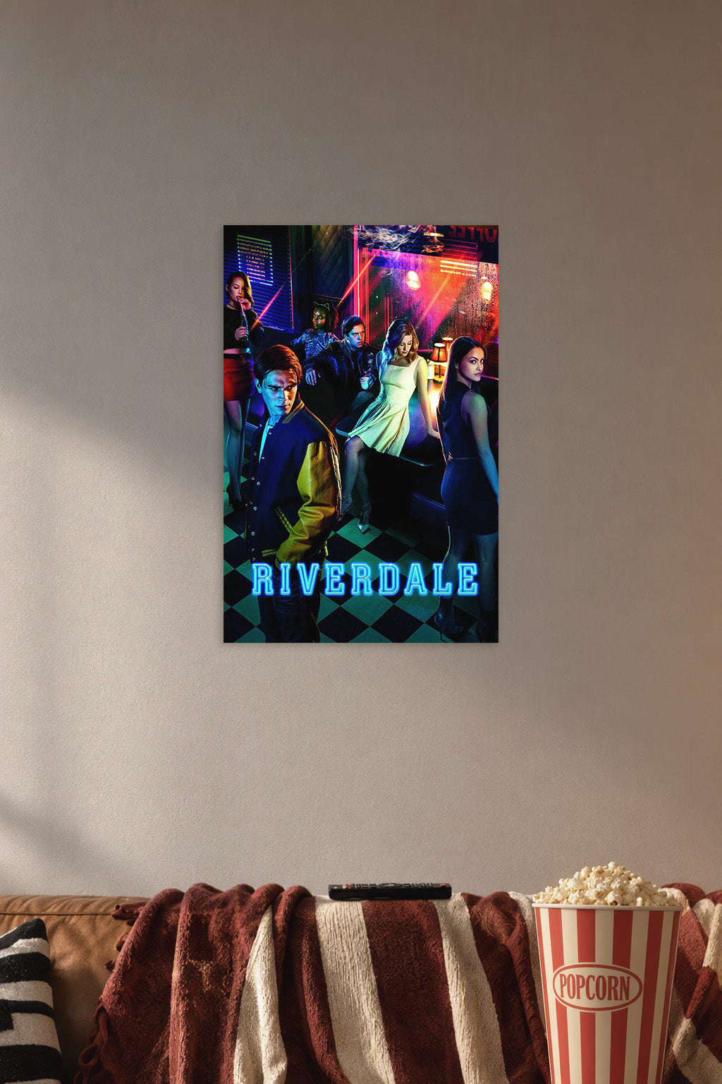 Riverdale TV Series in a cozy movie room above a brown sofa with popcorn.