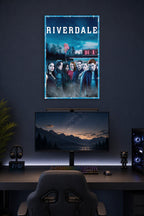 Riverdale TV Show Main Cast in a gaming desk setup above a monitor.