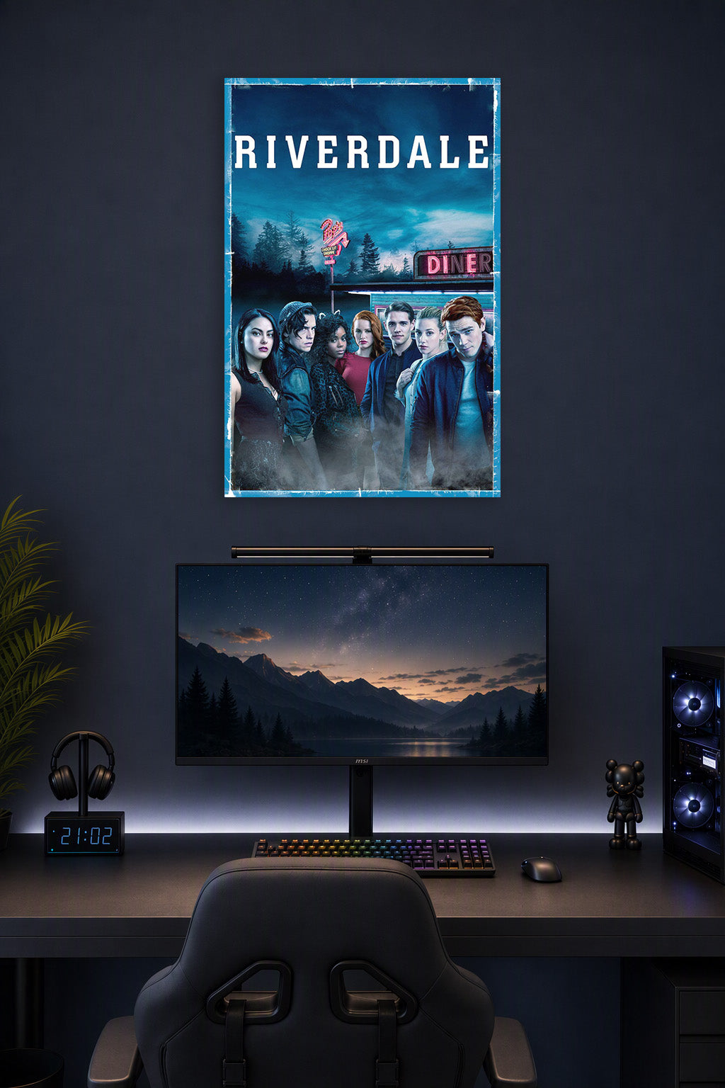 Riverdale TV Show Main Cast in a gaming desk setup above a monitor.
