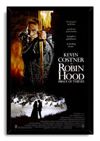 Robin Hood: Prince of Thieves framed wall art print depicts Kevin Costner aiming a flaming arrow over a couple by a lakeside tree.