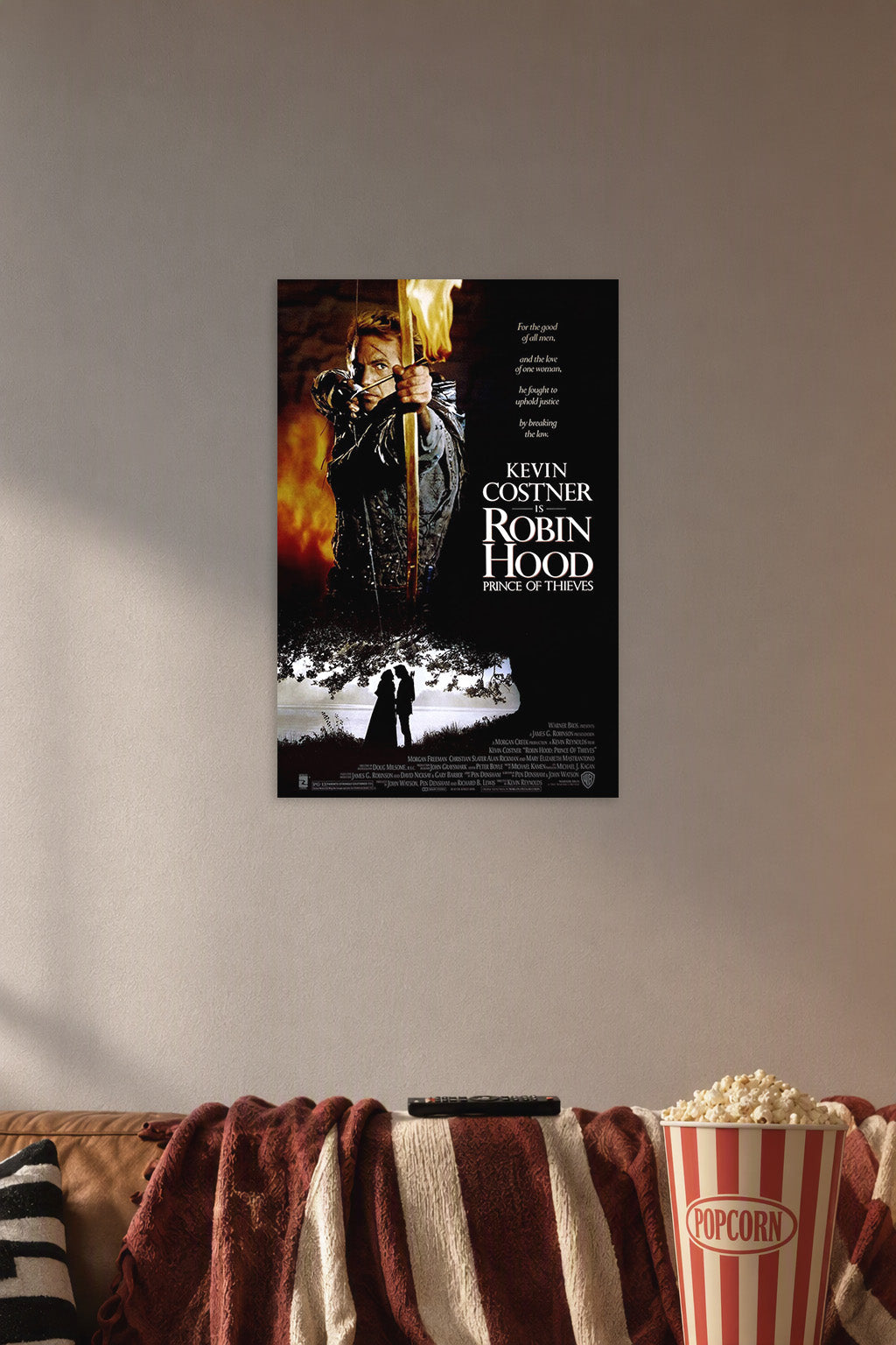 Robin Hood Prince of Thieves Movie Poster in a cozy movie room above a brown sofa with popcorn.
