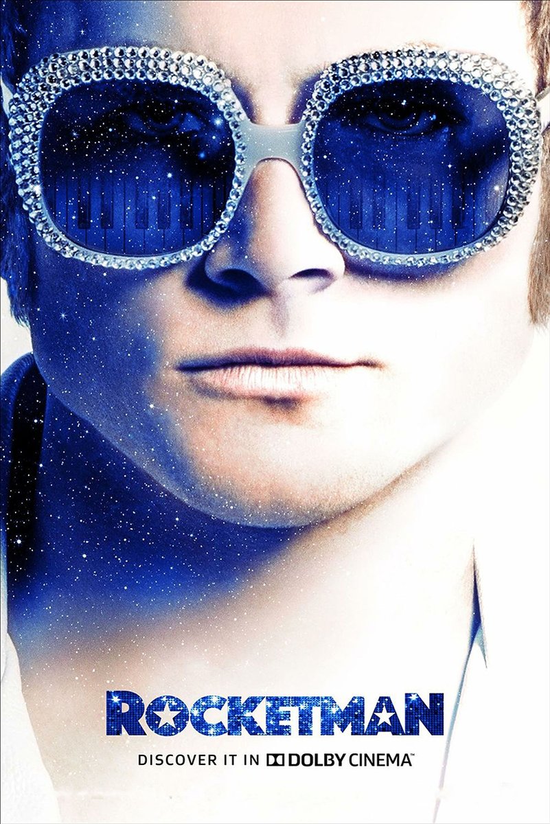 Rocketman poster features a close-up of Elton John in crystal-rimmed blue sunglasses reflecting piano keys and stars.