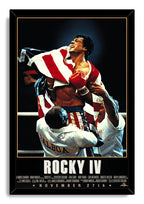 Rocky IV framed wall art print depicts Rocky Balboa wearing red gloves and flag-inspired trunks as trainers carry him.