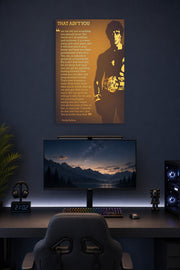 Rocky Balboa in a gaming desk setup above a monitor.
