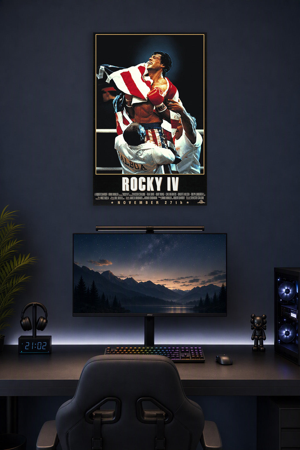 Rocky Balboa in a gaming desk setup above a monitor.