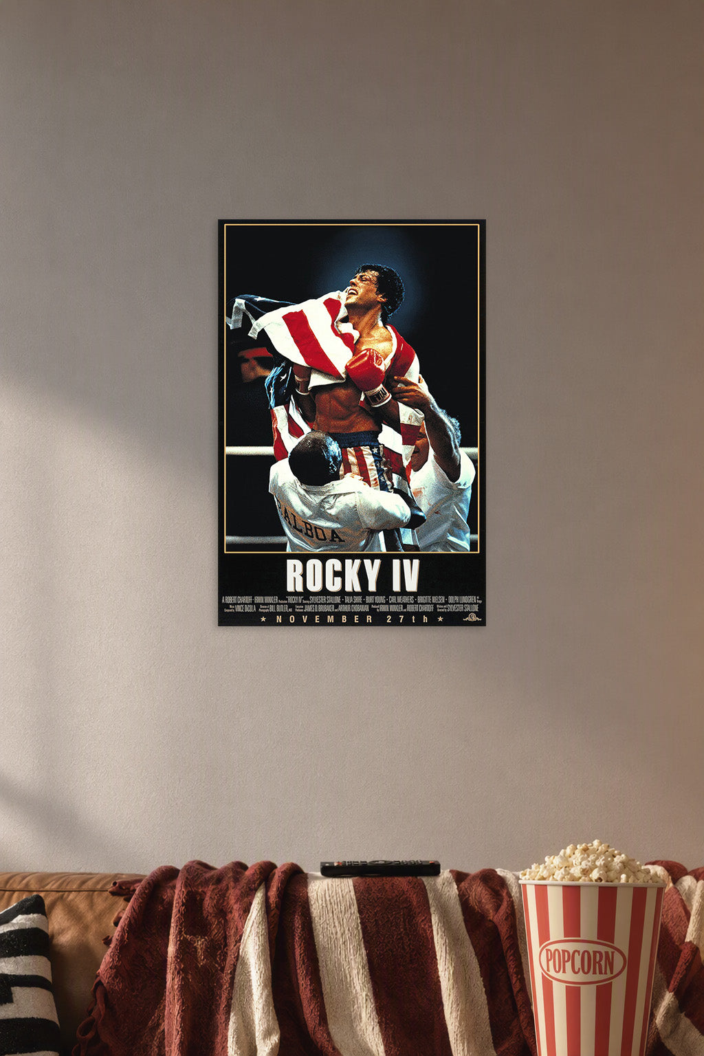 Rocky Balboa in a cozy movie room above a brown sofa with popcorn.
