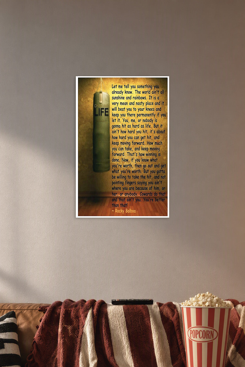 Rocky Balboa Motivational Quote in a cozy movie room above a brown sofa with popcorn.