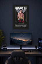 Rocky Balboa Rocky III in a gaming desk setup above a monitor.