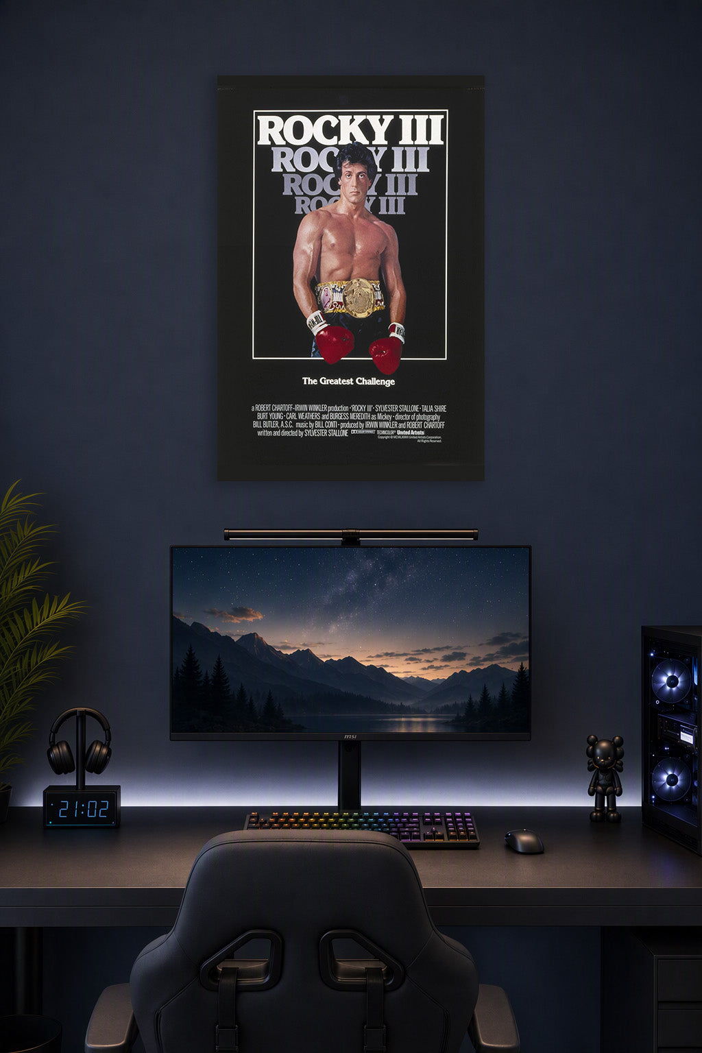 Rocky Balboa Rocky III in a gaming desk setup above a monitor.