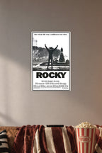 Rocky Balboa Triumphant in a cozy movie room above a brown sofa with popcorn.