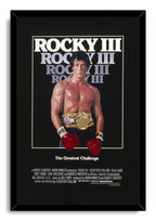 Rocky III framed wall art print presents Sylvester Stallone with red gloves, a gold belt, and The Greatest Challenge text.