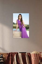 Rocsi Diaz in a cozy movie room above a brown sofa with popcorn.