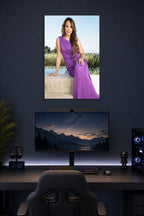 Rocsi Diaz in a gaming desk setup above a monitor.