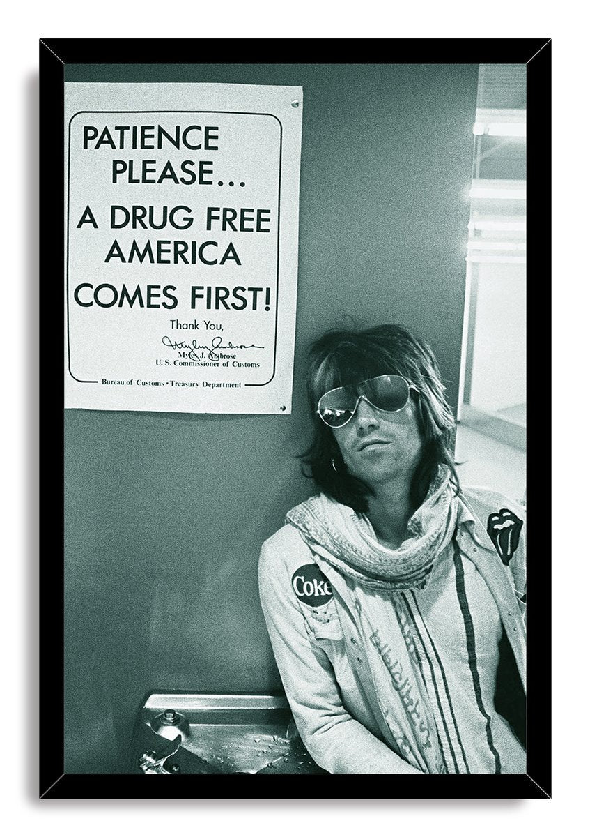 Framed Keith Richards wall art print with a black border, depicting the musician seated under a drug-free America notice.