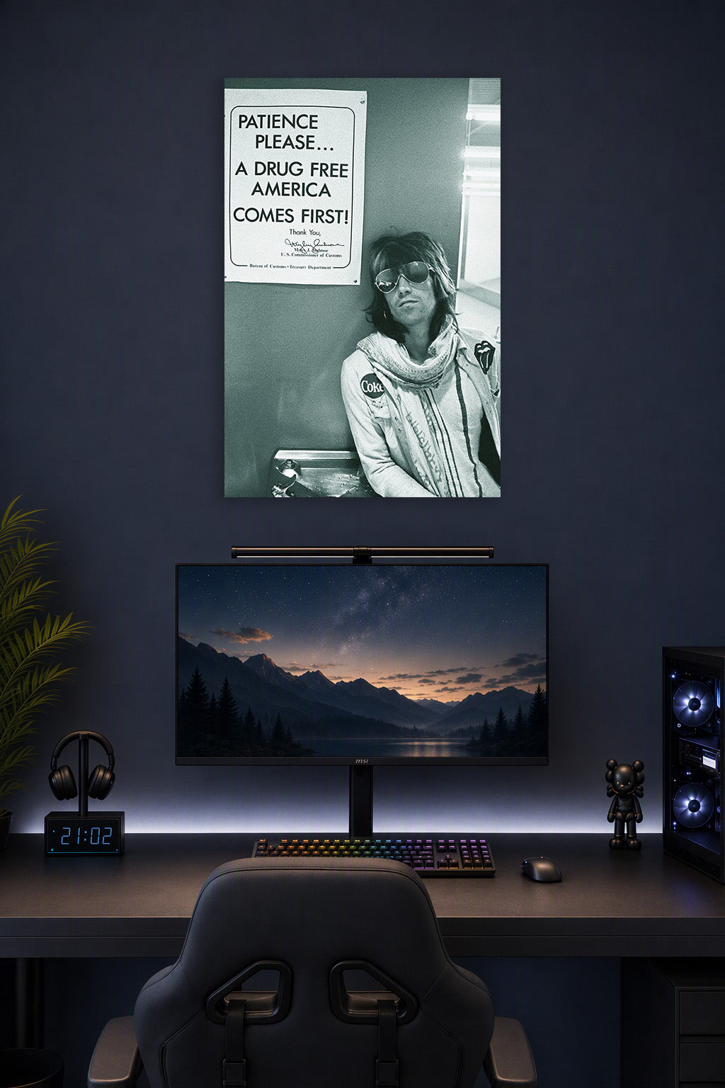 Rolling Stones Keith Richards in a gaming desk setup above a monitor.
