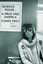 Keith Richards wall art print in black and white, seated in aviator sunglasses and scarf beneath a drug-free America sign.