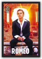 Romeo framed wall art print depicts a seated young man in a dark suit against a fiery orange damaged interior.