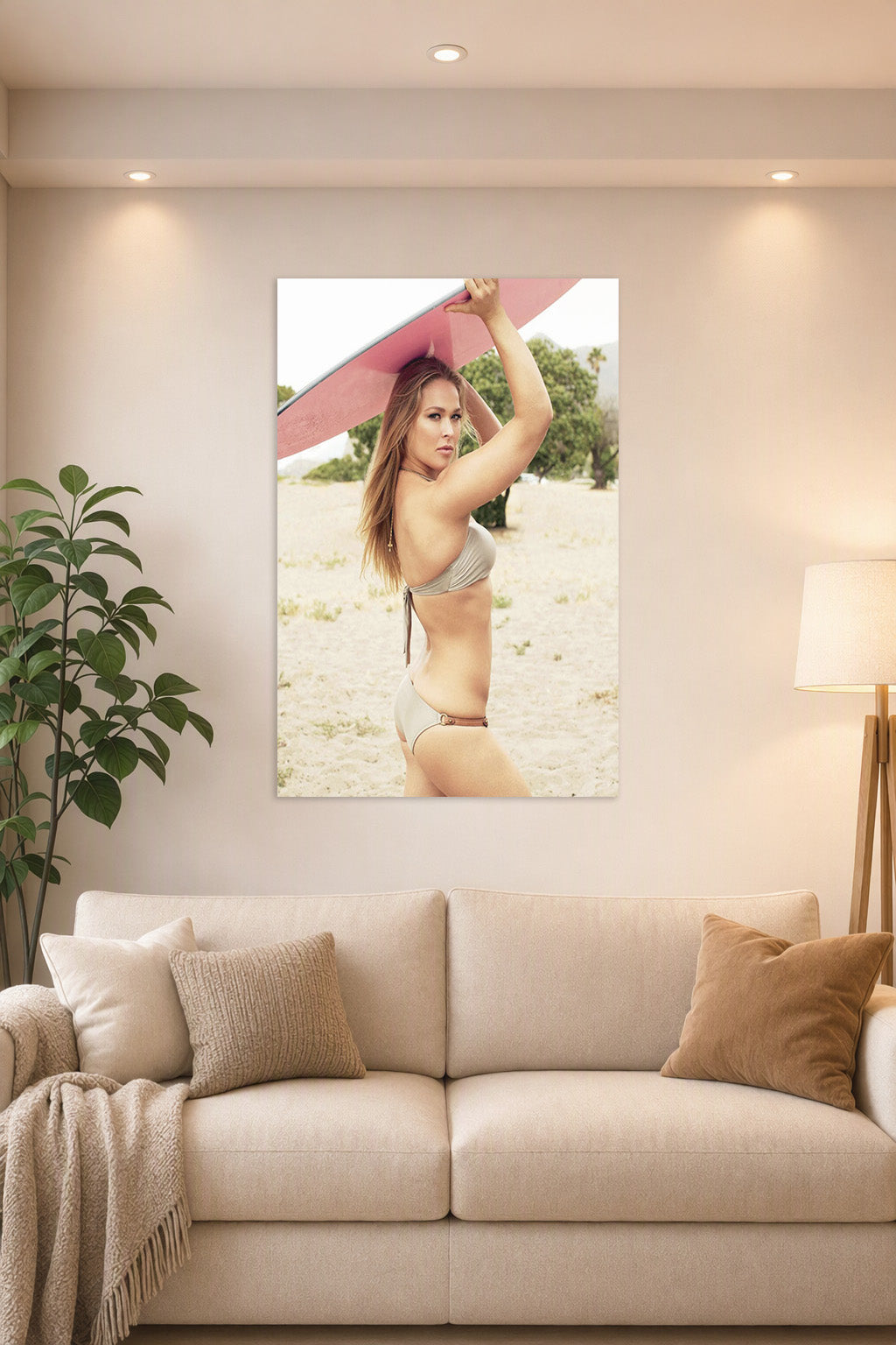 Ronda Rousey in a bright living room above a beige sofa.