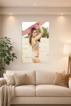Ronda Rousey in a bright living room above a beige sofa.