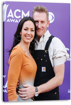 Rory and Joey Feek canvas wall art print presents the couple smiling together against a purple ACM Awards backdrop.