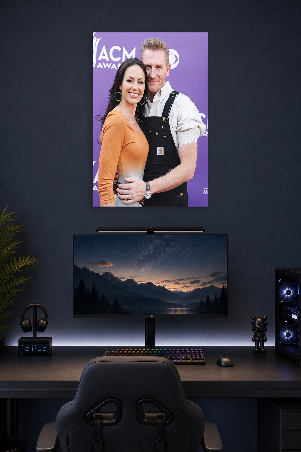 Rory and Joey Feek in a gaming desk setup above a monitor.