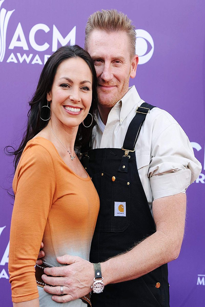 Rory and Joey Feek wall art print features the smiling couple embracing before a purple ACM Awards backdrop.