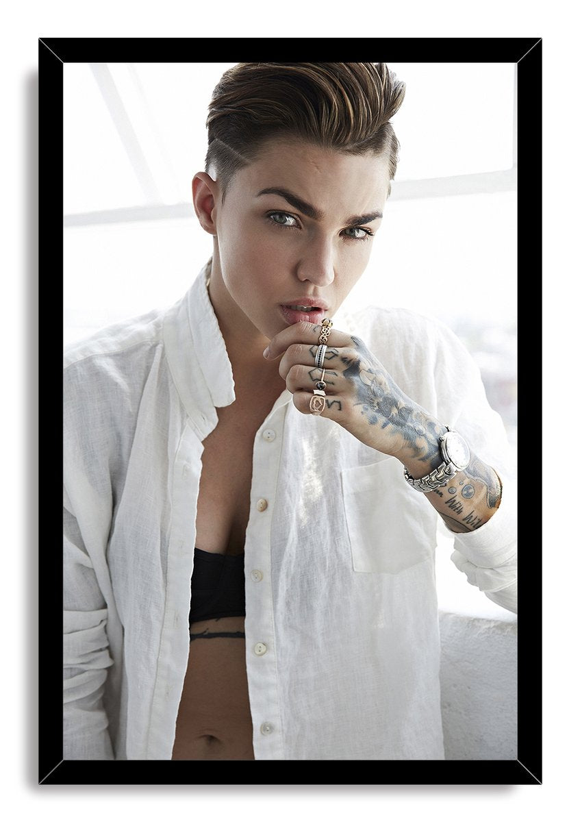 Ruby Rose framed wall art print features her close portrait in a white shirt, set within a sleek black rectangular frame.